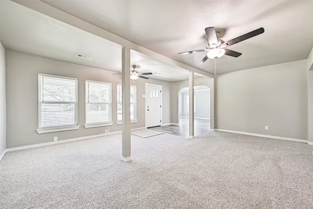 a view of an empty room with a window