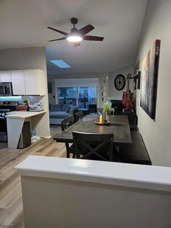 a kitchen with kitchen island granite countertop a stove and a refrigerator