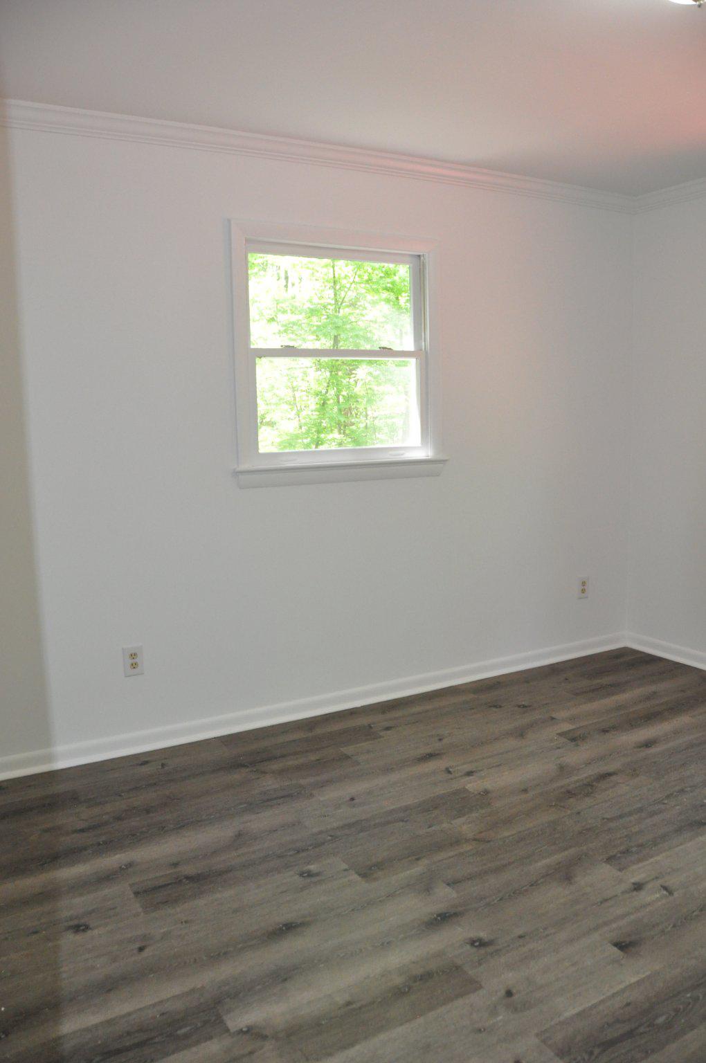 28 Henry Way Linden, VA 22642 - Photo 16 of 39 a view of an empty room with wooden floor and a window