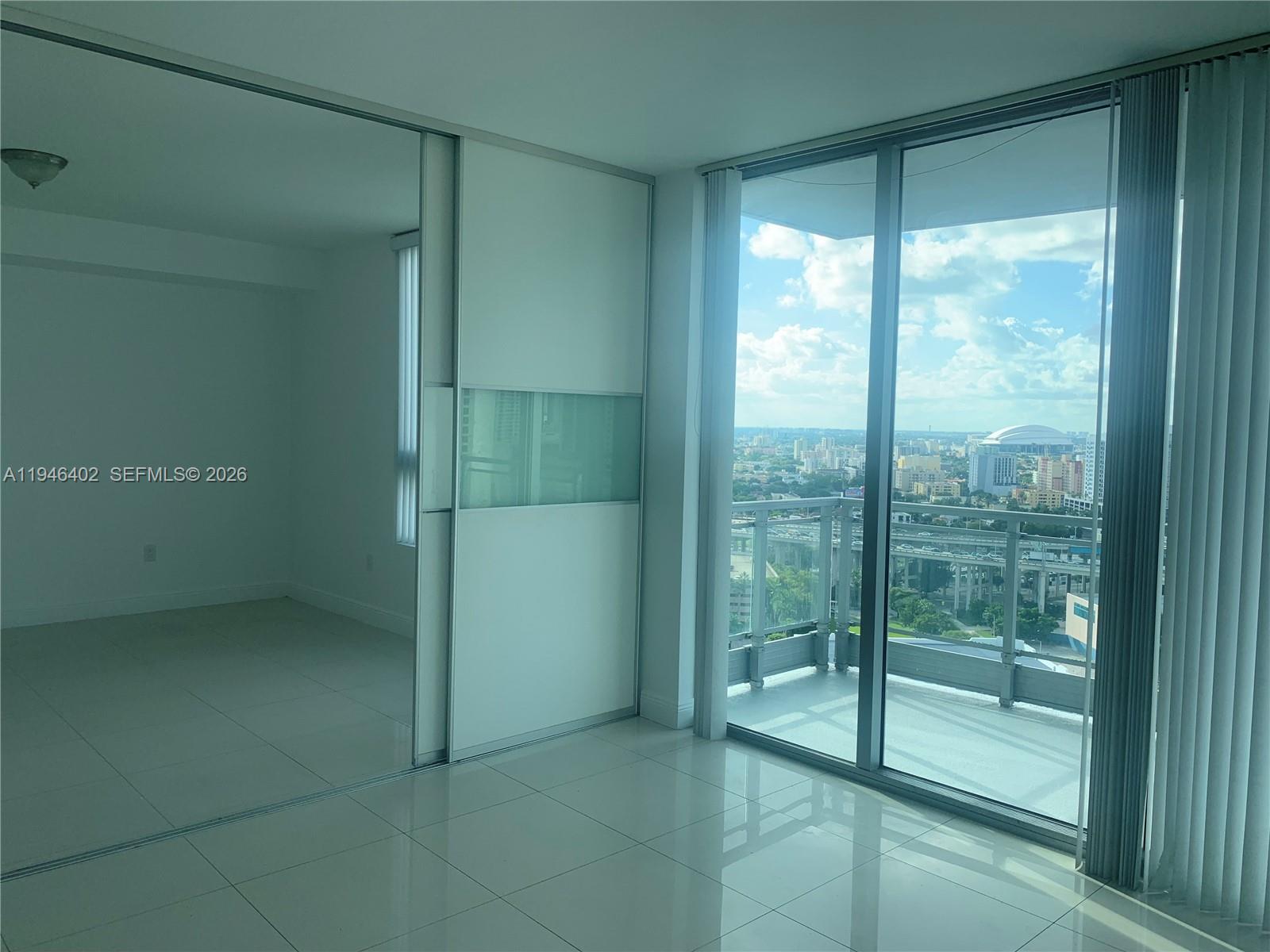 90 Southwest 3rd Street, Unit 2305 Miami, FL 33130 - Photo 6 of 13 a bathroom with a glass shower door