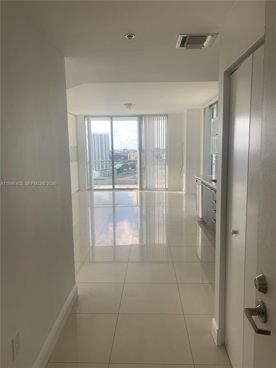 90 Southwest 3rd Street, Unit 2305 Miami, FL 33130 - Photo 8 of 13 a bathroom with a glass shower door