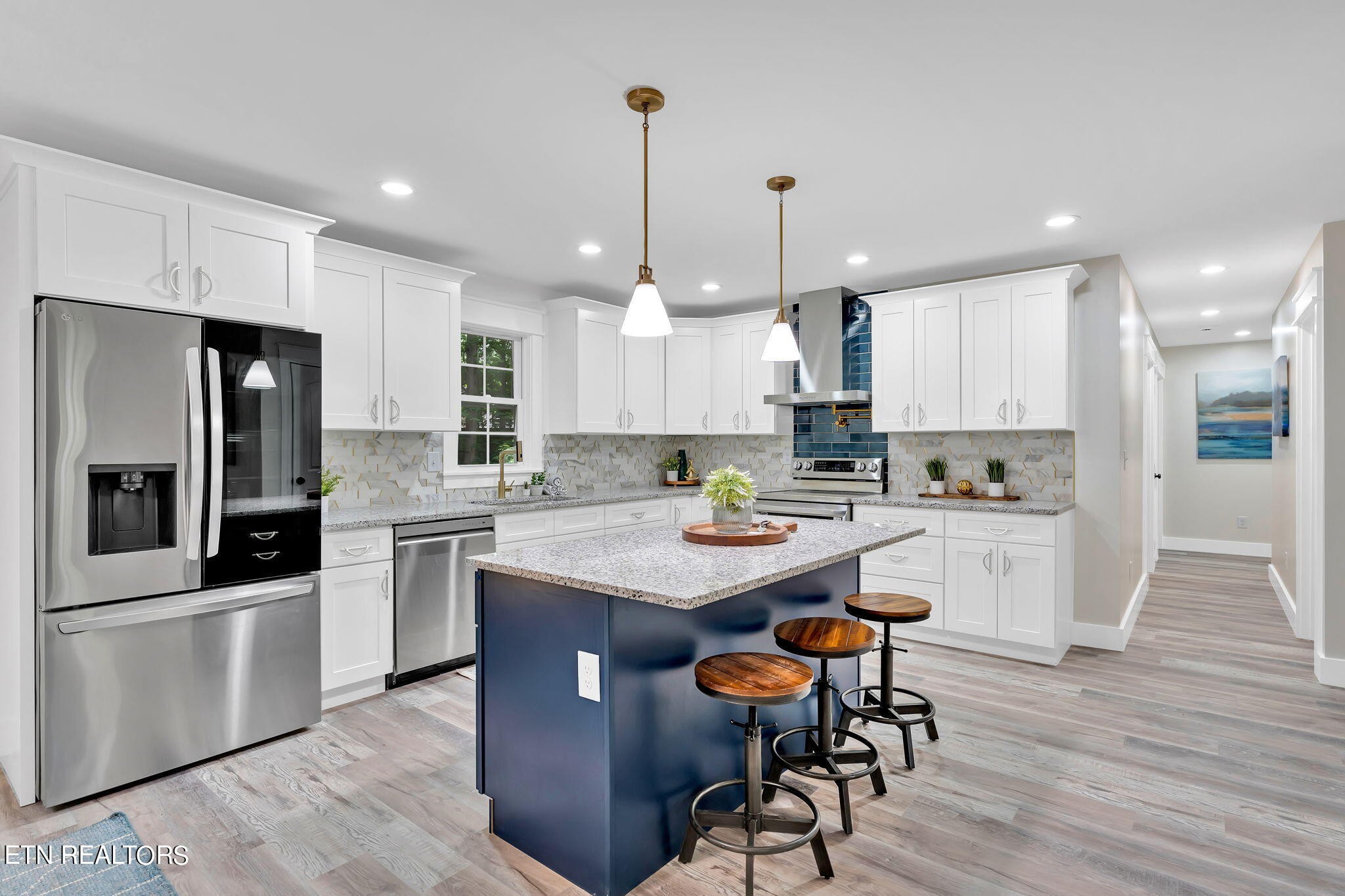 159 Country Way Road Vonore, TN 37885 - Photo 12 of 32 a kitchen with stainless steel appliances kitchen island granite countertop a table chairs refrigerator and microwave