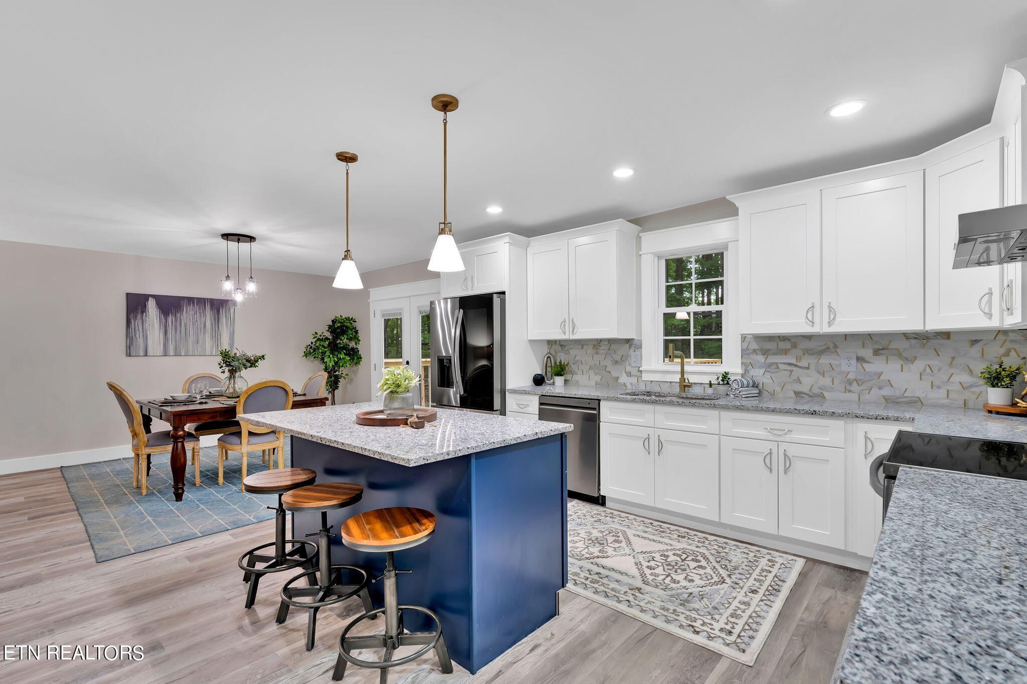 159 Country Way Road Vonore, TN 37885 - Photo 15 of 32 a kitchen with stainless steel appliances kitchen island granite countertop a table chairs sink and cabinets