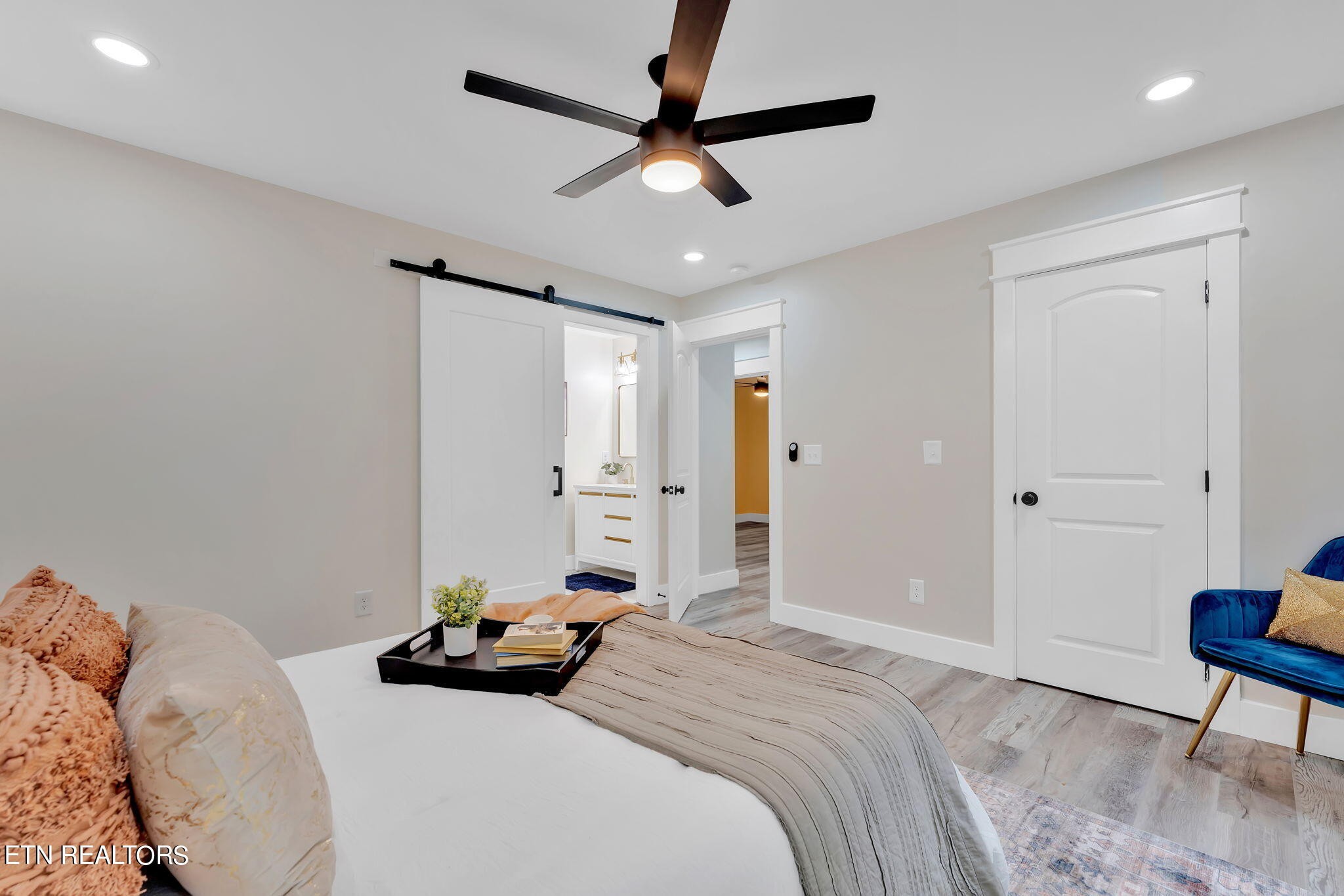 159 Country Way Road Vonore, TN 37885 - Photo 27 of 32 a bedroom with a bed and a chandelier