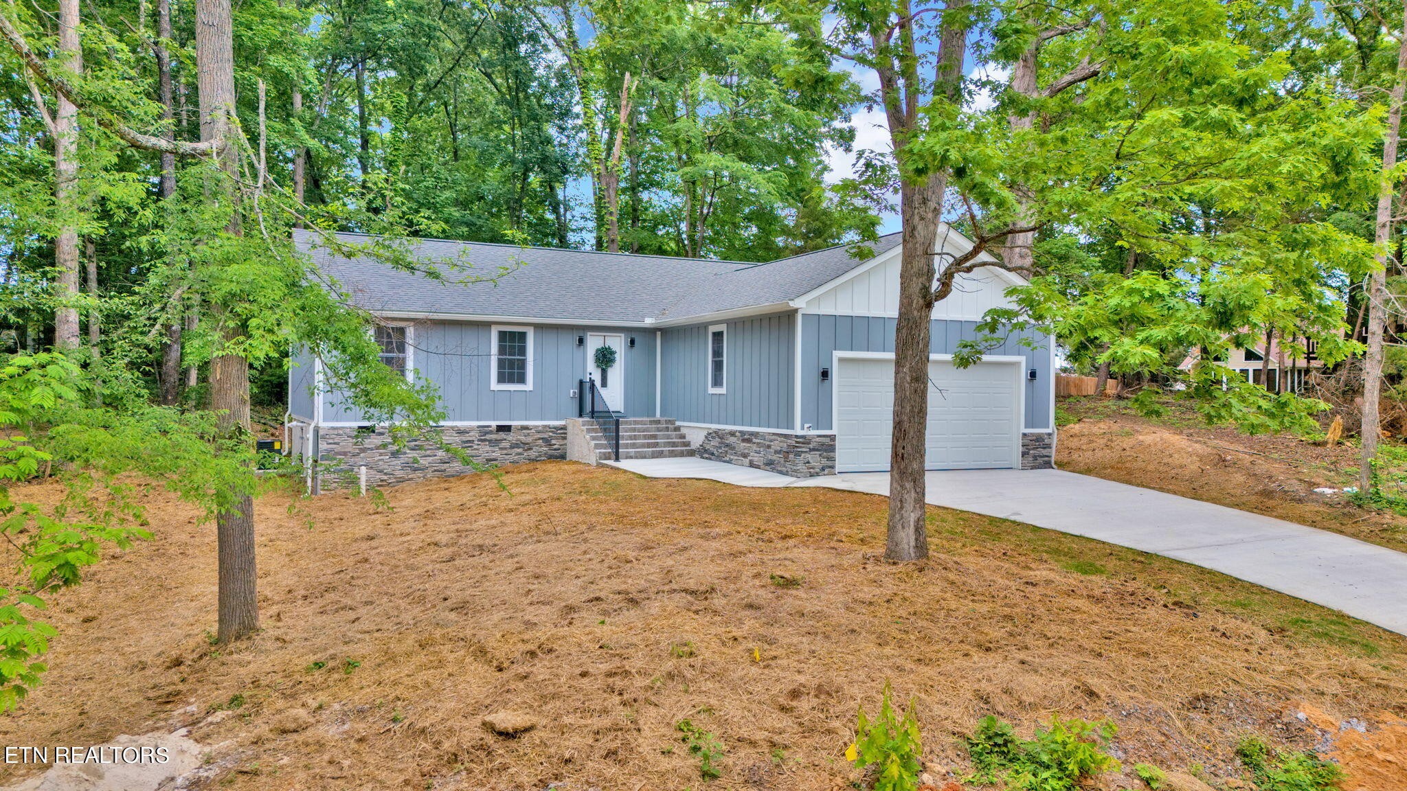 159 Country Way Road Vonore, TN 37885 - Photo 3 of 32 a house with trees in the background