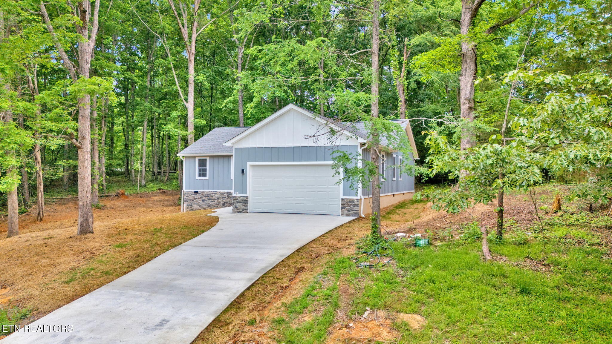 159 Country Way Road Vonore, TN 37885 - Photo 4 of 32 a house with trees in the background