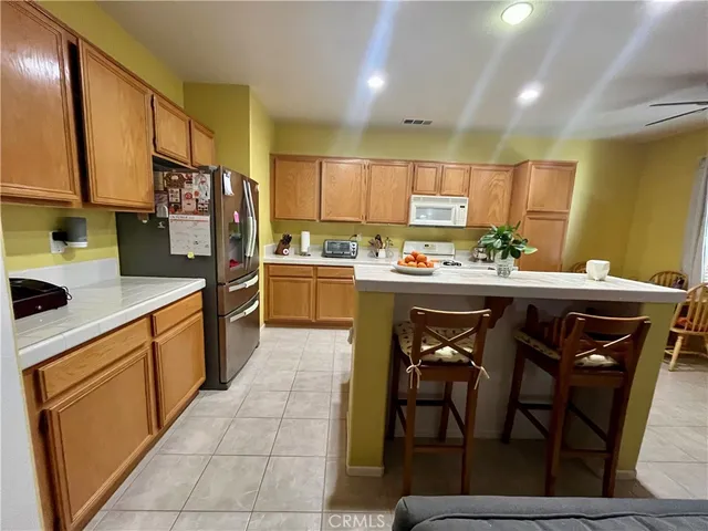 a dining room with furniture and a chandelier