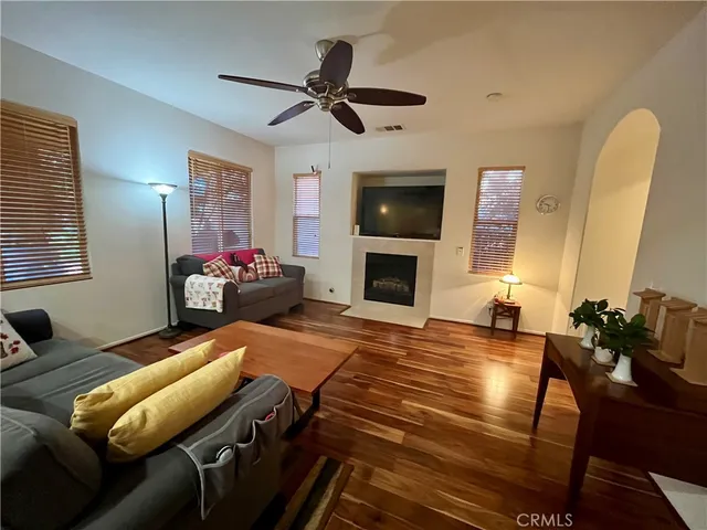 a kitchen with a table chairs stove and cabinets