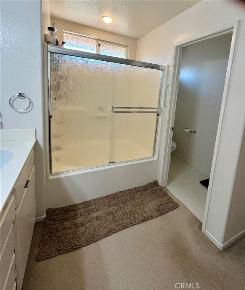 1483 Albillo Loop Perris, CA 92571 - Photo 20 of 46 a bathroom with a bathtub and a shower