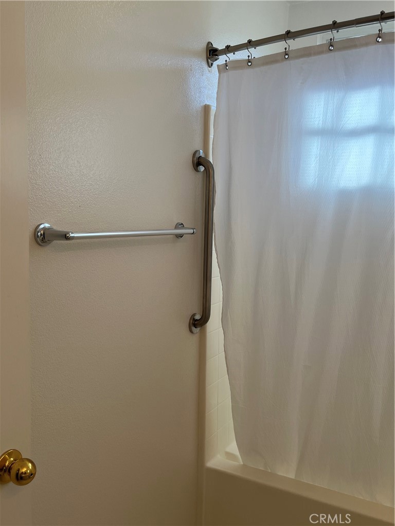 1483 Albillo Loop Perris, CA 92571 - Photo 25 of 46 a bathroom with a shower
