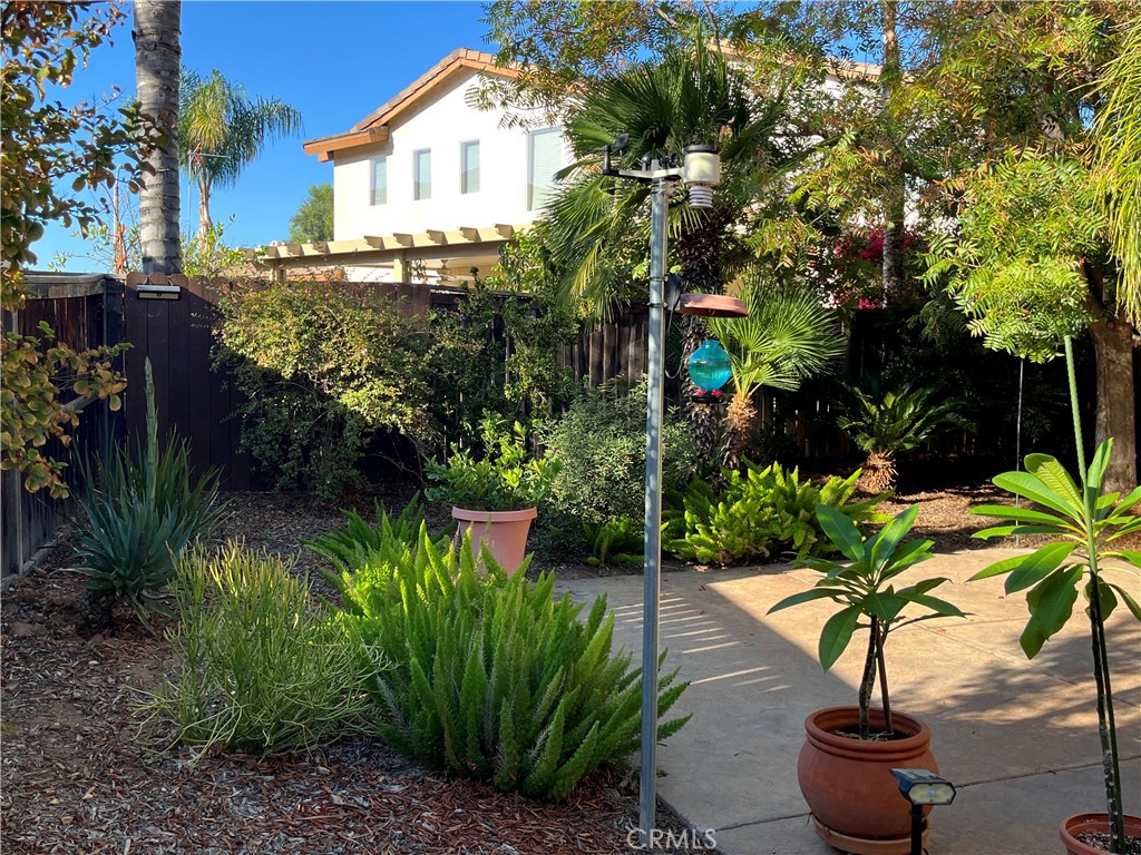 1483 Albillo Loop Perris, CA 92571 - Photo 28 of 46 a view of a garden with plants