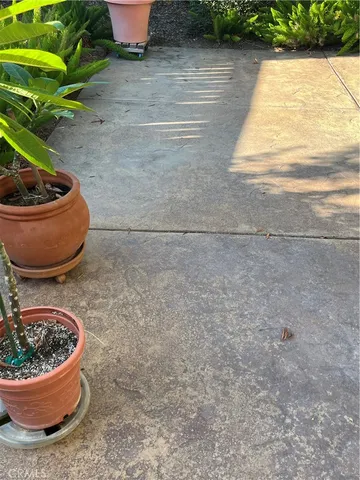 a view of roof deck with wooden floor and fence