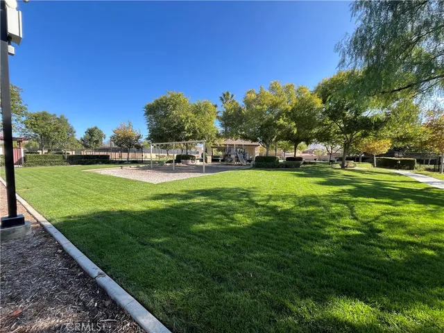 a view of a house with sitting area and garden