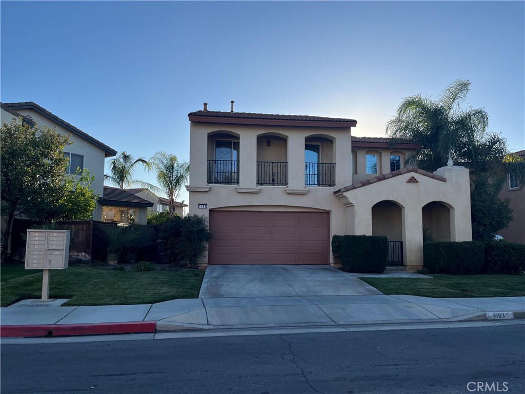 1483 Albillo Loop Perris, CA 92571 - Photo 4 of 46 a front view of a house with a garden