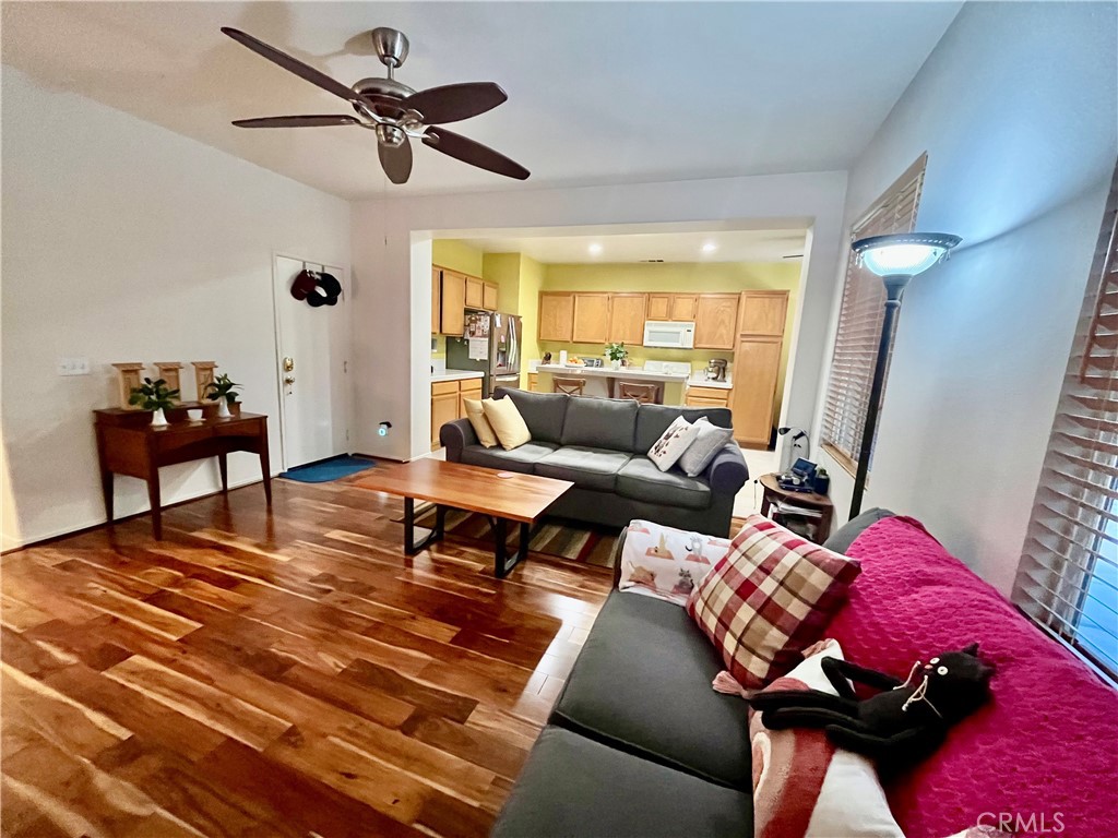 1483 Albillo Loop Perris, CA 92571 - Photo 6 of 46 a living room with furniture and a large window