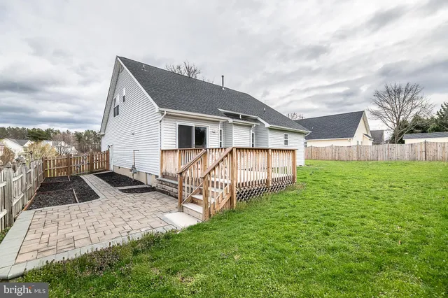 a front view of house with yard and seating area