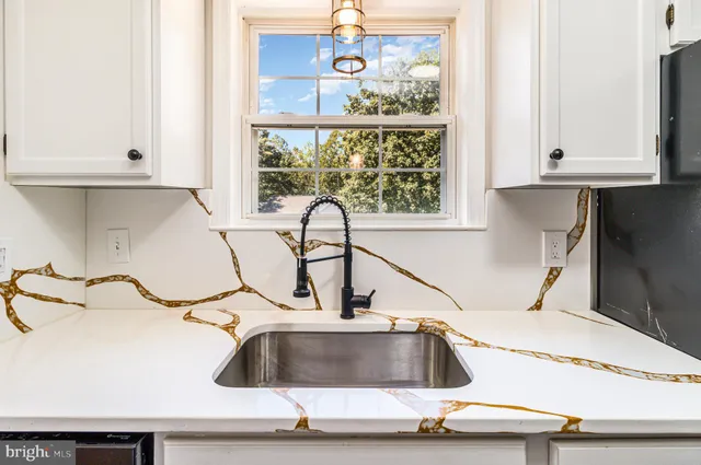 a kitchen with a sink and a window