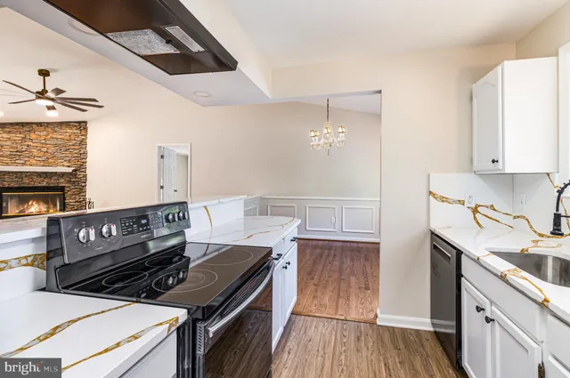 a kitchen with a stove and a microwave oven
