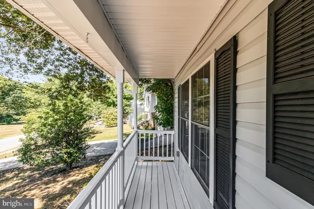 a view of balcony with wooden floor
