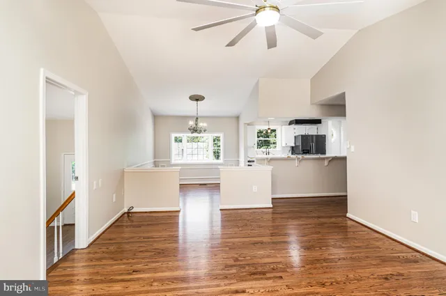 a view of kitchen and hall with wooden floor