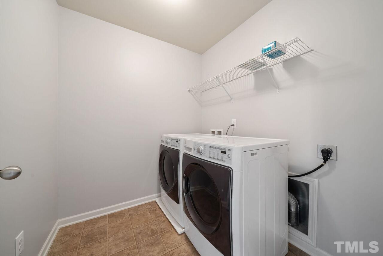 1026 Ileagnes Road Raleigh, NC 27603 - Photo 19 of 29 a utility room with dryer and washer