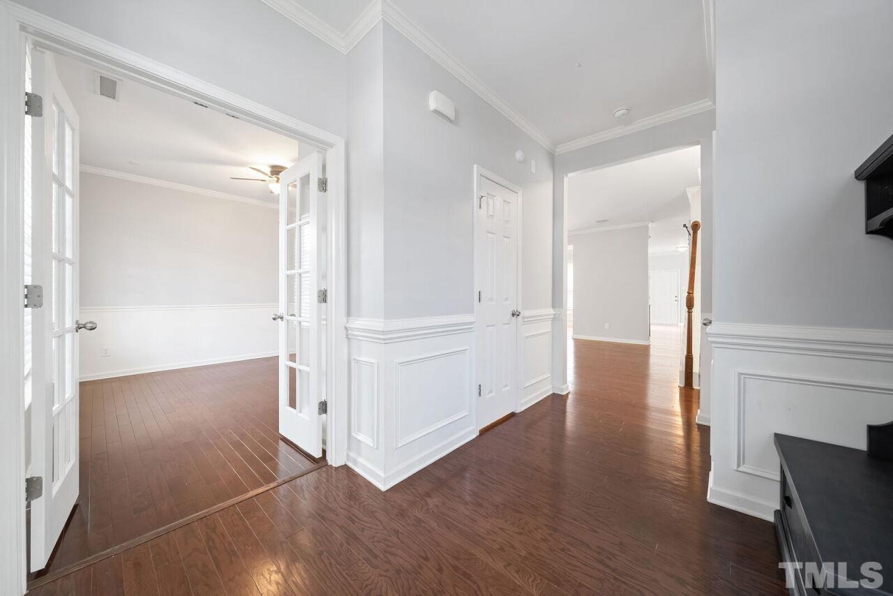 1026 Ileagnes Road Raleigh, NC 27603 - Photo 4 of 29 a view of a hallway with wooden floor