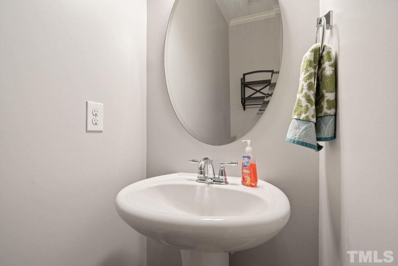 1026 Ileagnes Road Raleigh, NC 27603 - Photo 6 of 29 a bathroom with a sink and a mirror
