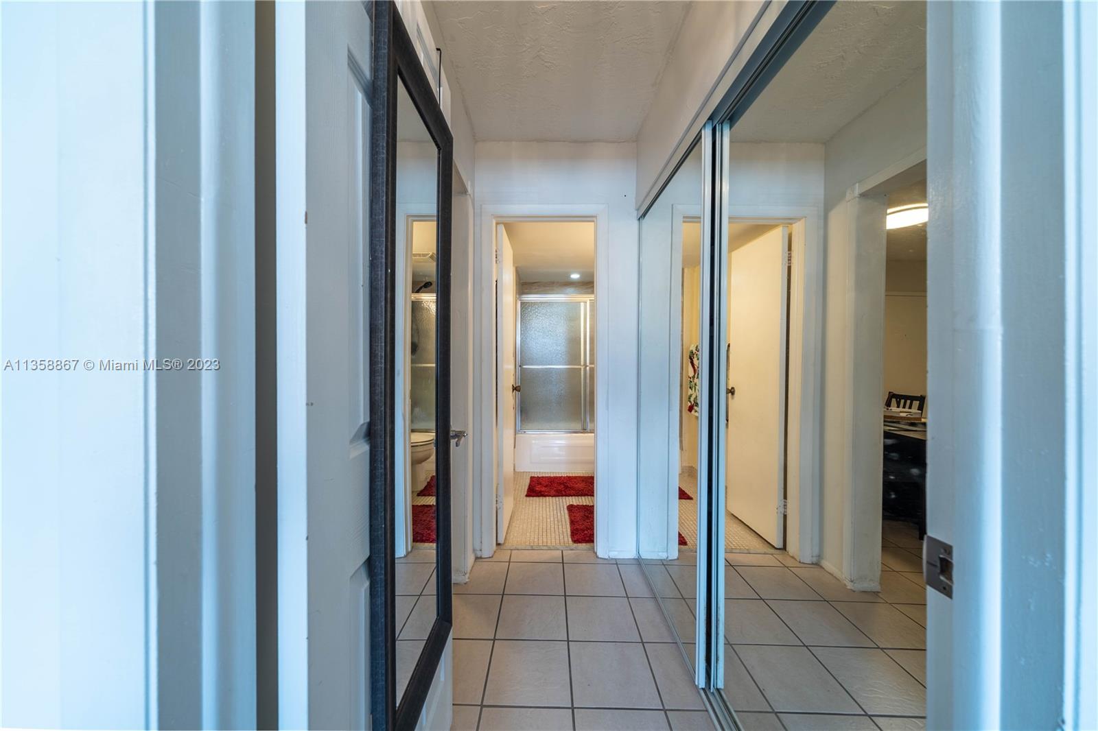 7300 Northwest 17th Street, Unit 314 Plantation, FL 33313 - Photo 16 of 30 a view of a hallway and an dining rom with furniture