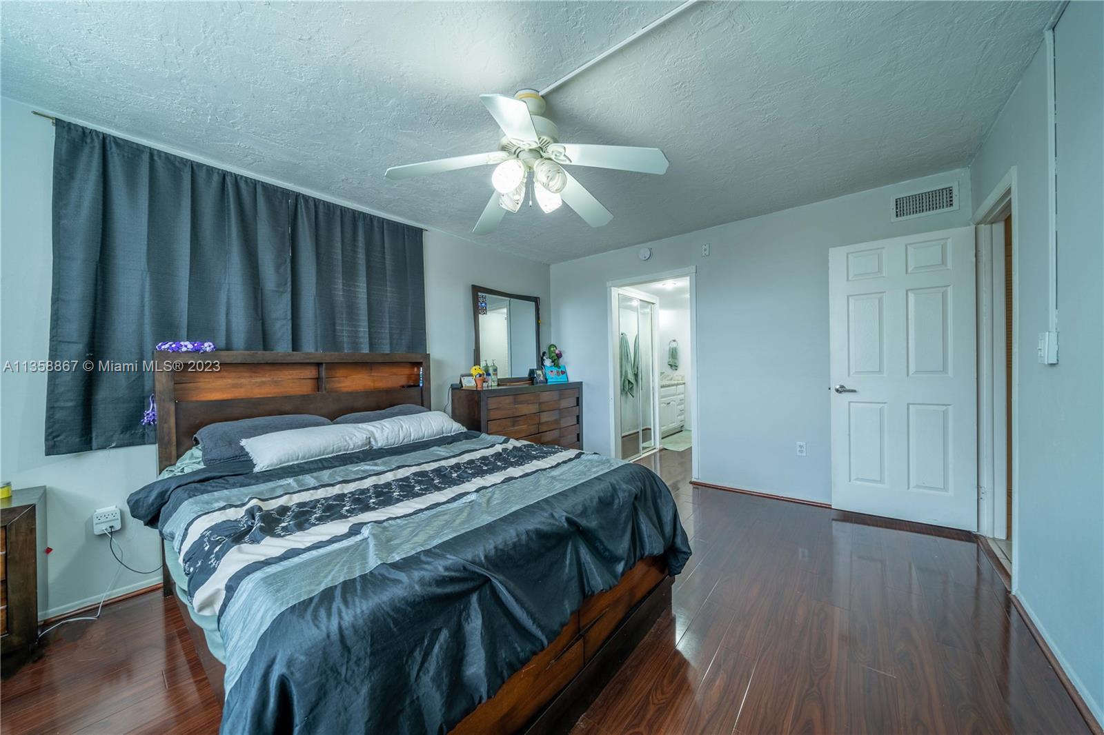 7300 Northwest 17th Street, Unit 314 Plantation, FL 33313 - Photo 8 of 30 a bedroom with a bed and a chandelier