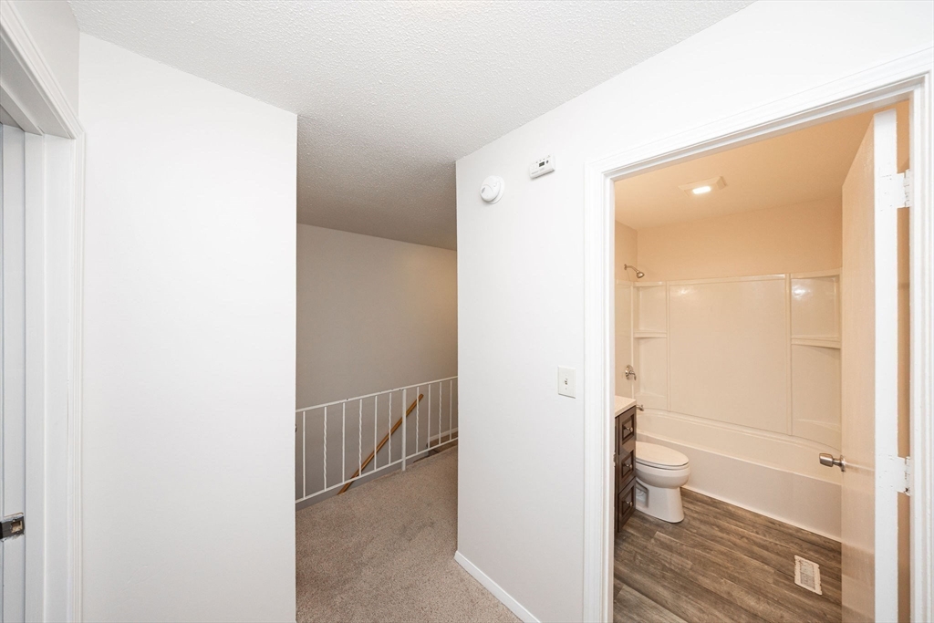 618 Edgebrook Drive, Unit 618 Boylston, MA 01505 - Photo 11 of 37 a bathroom with a shower and a toilet