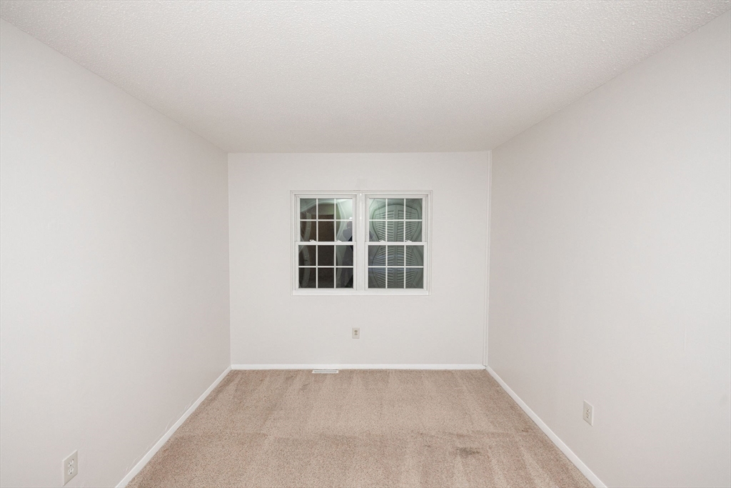 618 Edgebrook Drive, Unit 618 Boylston, MA 01505 - Photo 13 of 37 a view of an empty room with a window