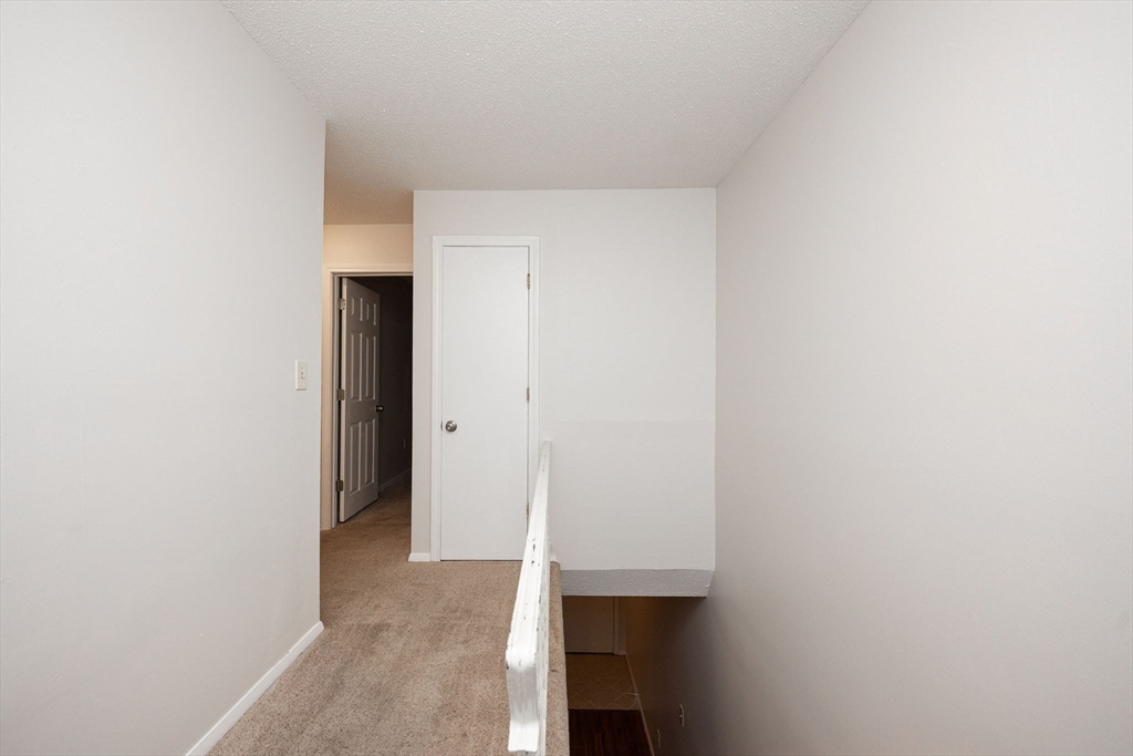 618 Edgebrook Drive, Unit 618 Boylston, MA 01505 - Photo 15 of 37 a view of hallway with closet