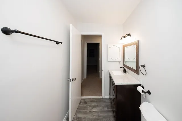 a bathroom with a sink and mirror