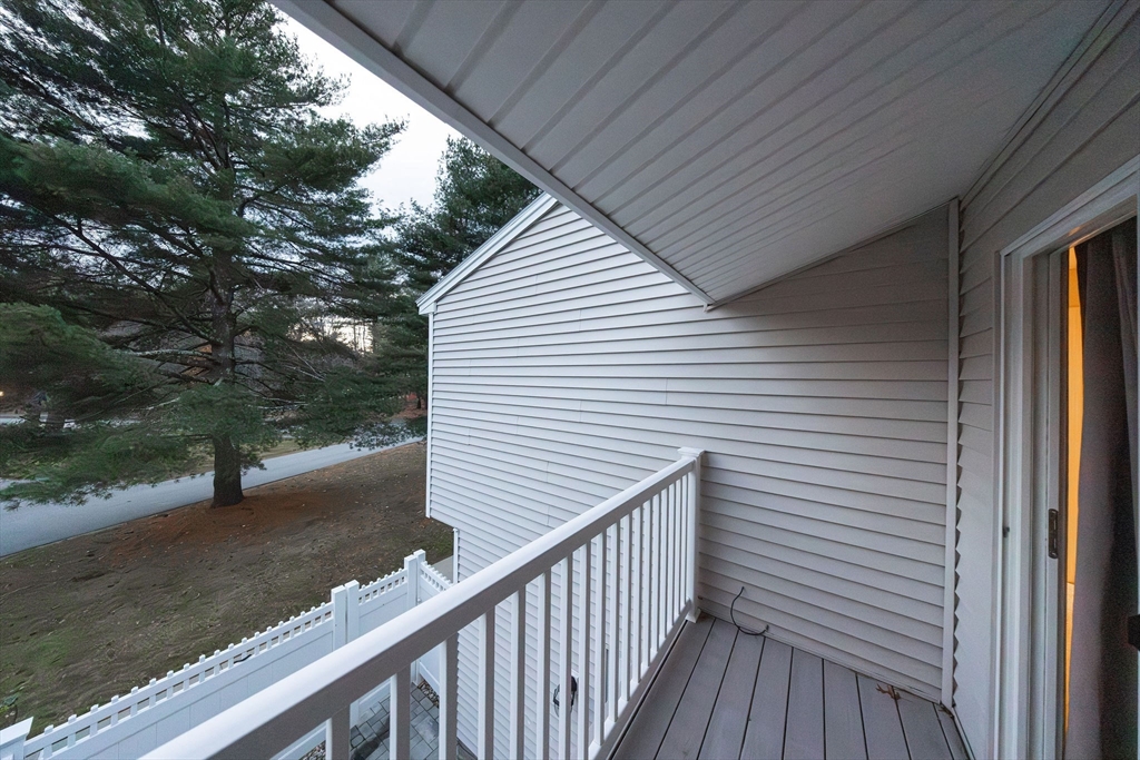 618 Edgebrook Drive, Unit 618 Boylston, MA 01505 - Photo 29 of 37 a view of a wooden deck front of house