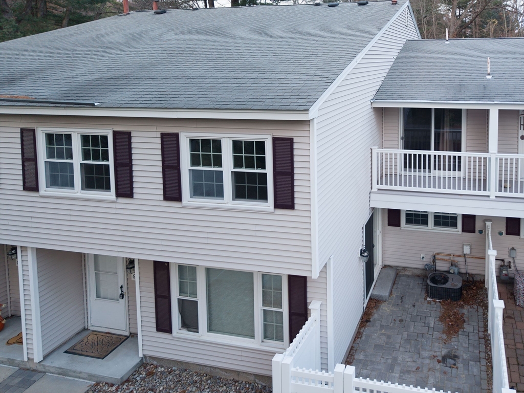 618 Edgebrook Drive, Unit 618 Boylston, MA 01505 - Photo 32 of 37 a view of a house with a yard