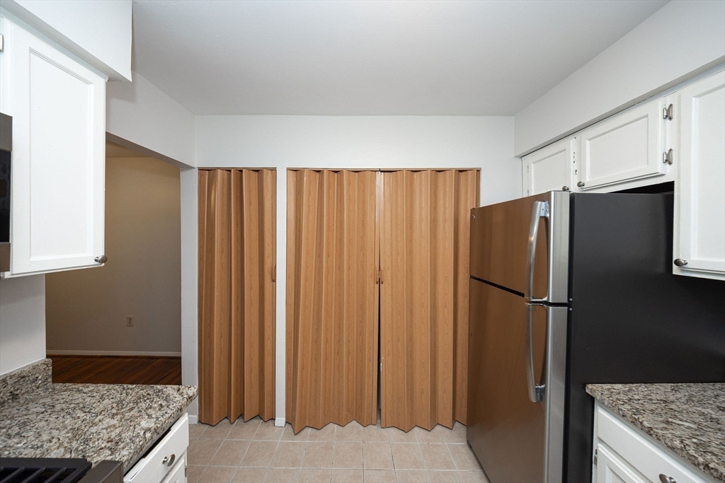 618 Edgebrook Drive, Unit 618 Boylston, MA 01505 - Photo 8 of 37 a kitchen with stainless steel appliances granite countertop a refrigerator and a sink