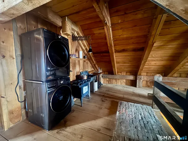 a view of a gym with wooden floor