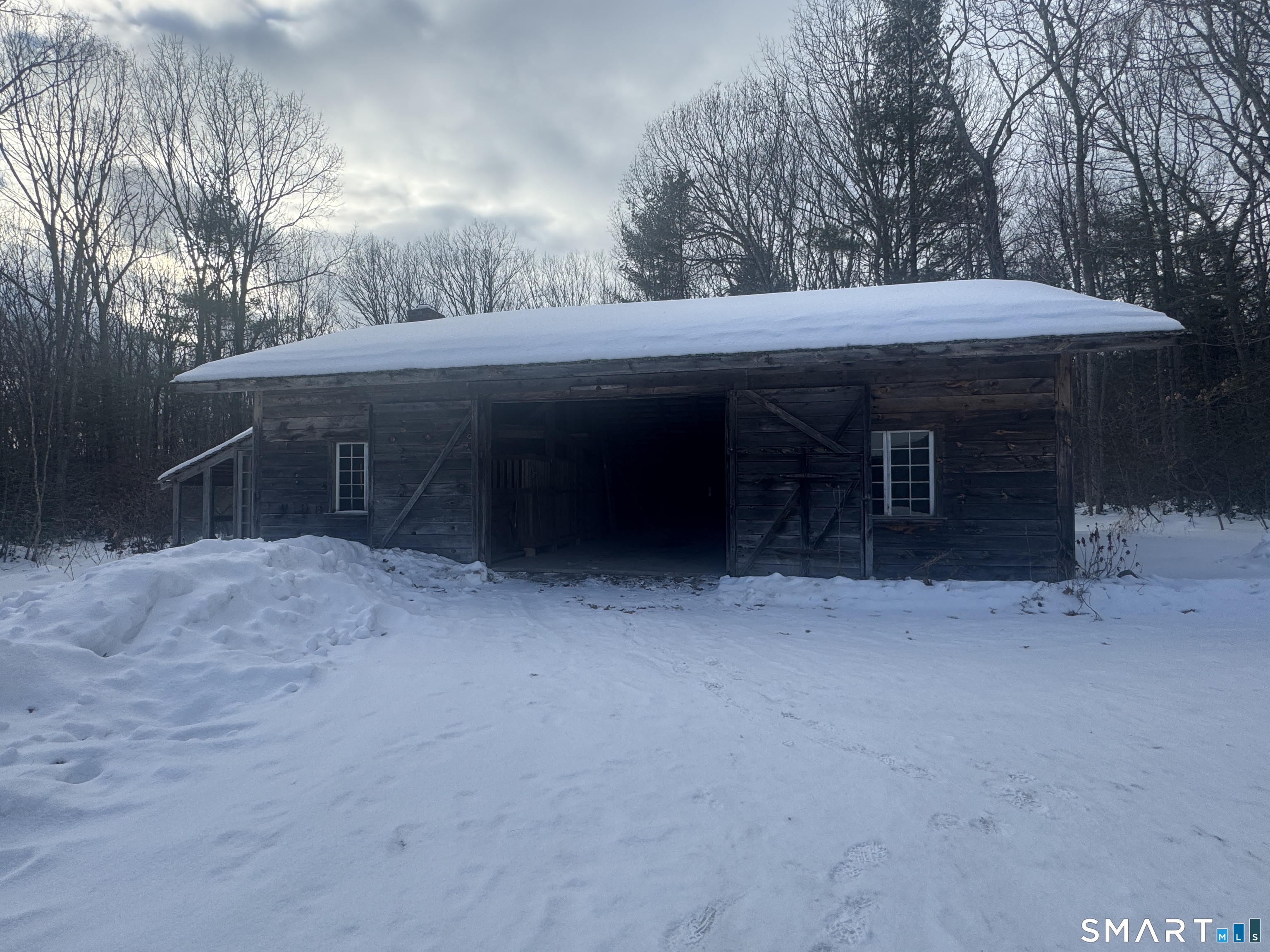 45 Hoppen Road, Unit MAIN New Hartford, CT 06057 - Photo 19 of 49 a view of a house with a yard and tree