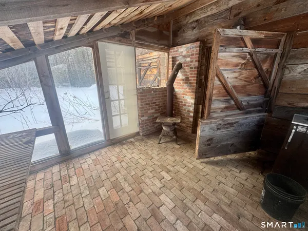 a view of a porch with seating space