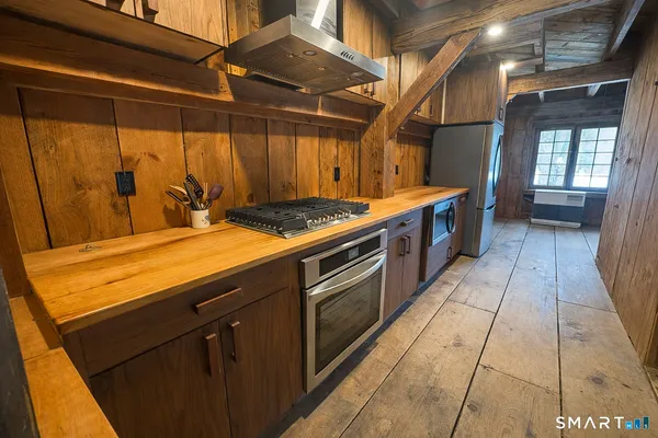 a view of a hall with wooden floor