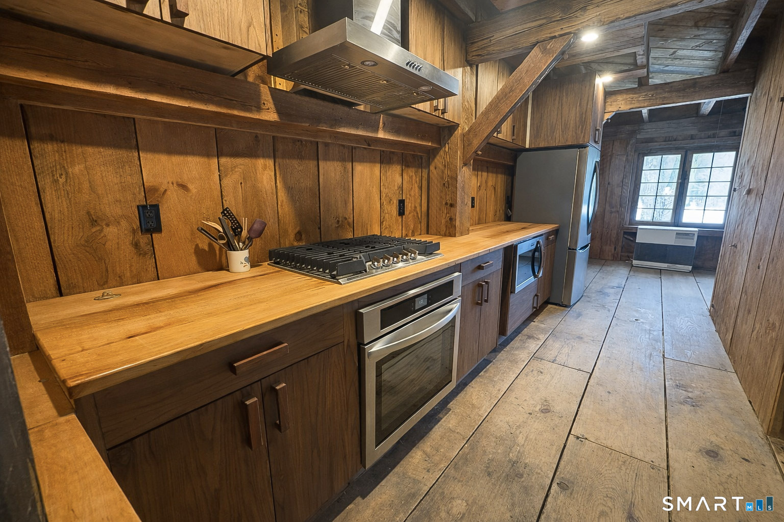 45 Hoppen Road, Unit MAIN New Hartford, CT 06057 - Photo 39 of 49 a kitchen with stainless steel appliances granite countertop a stove a sink and a microwave