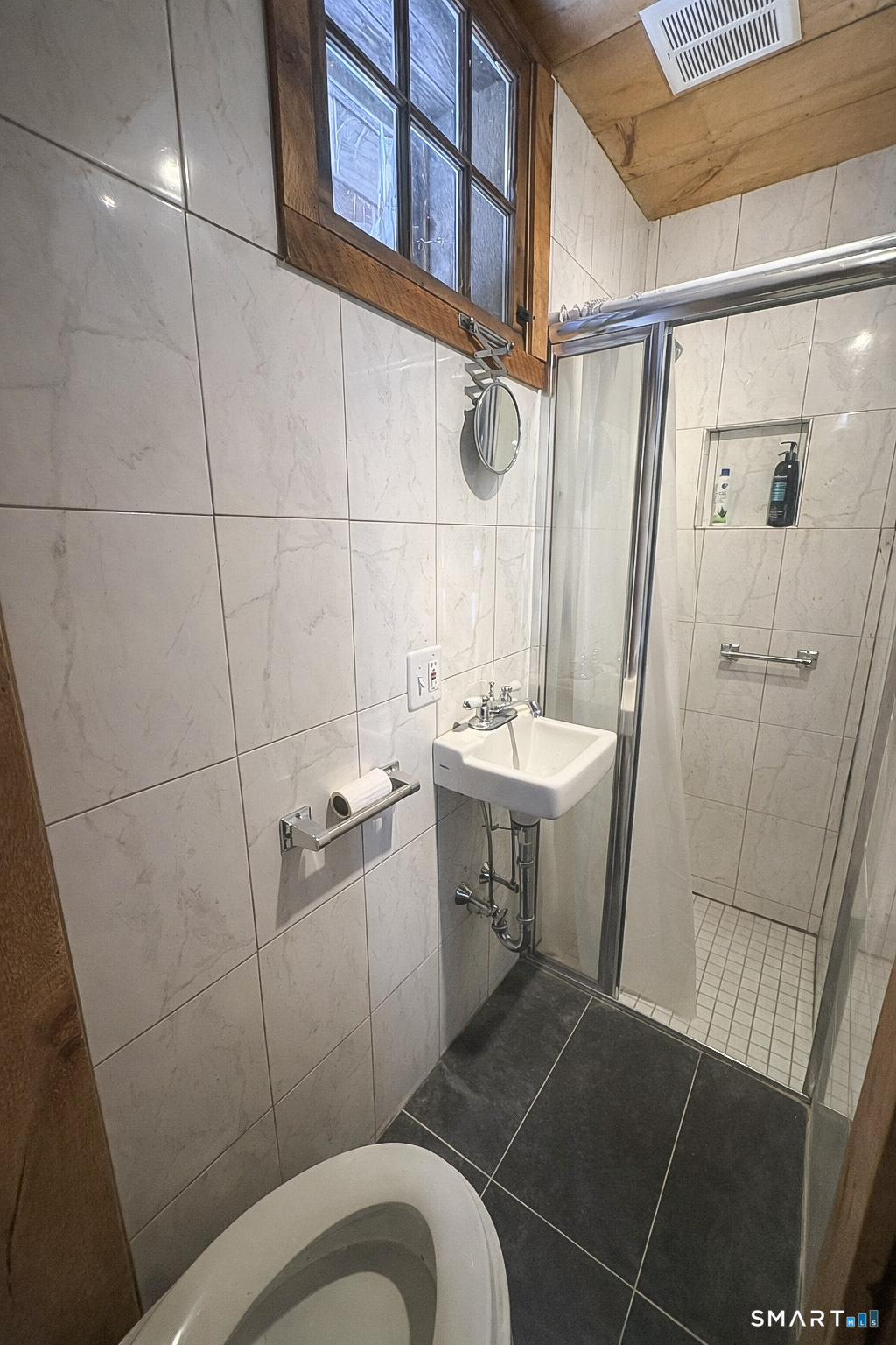 45 Hoppen Road, Unit MAIN New Hartford, CT 06057 - Photo 45 of 49 a bathroom with a sink mirror vanity and toilet