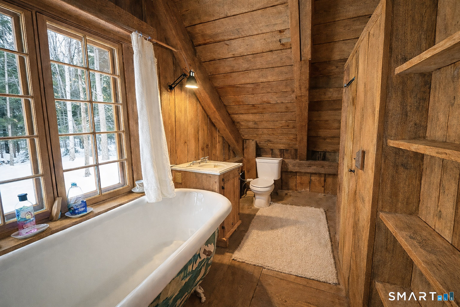 45 Hoppen Road, Unit MAIN New Hartford, CT 06057 - Photo 46 of 49 a living room with a large window