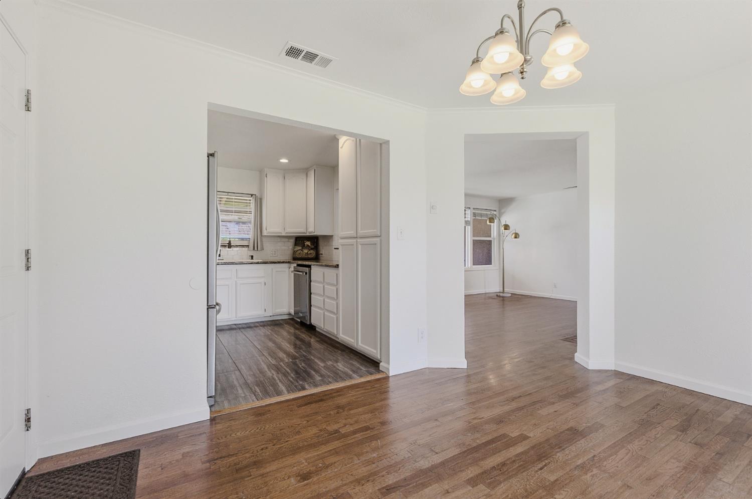 2511 Verna Way Sacramento, CA 95821 - Photo 16 of 34 a view of a kitchen with a sink and wooden floor
