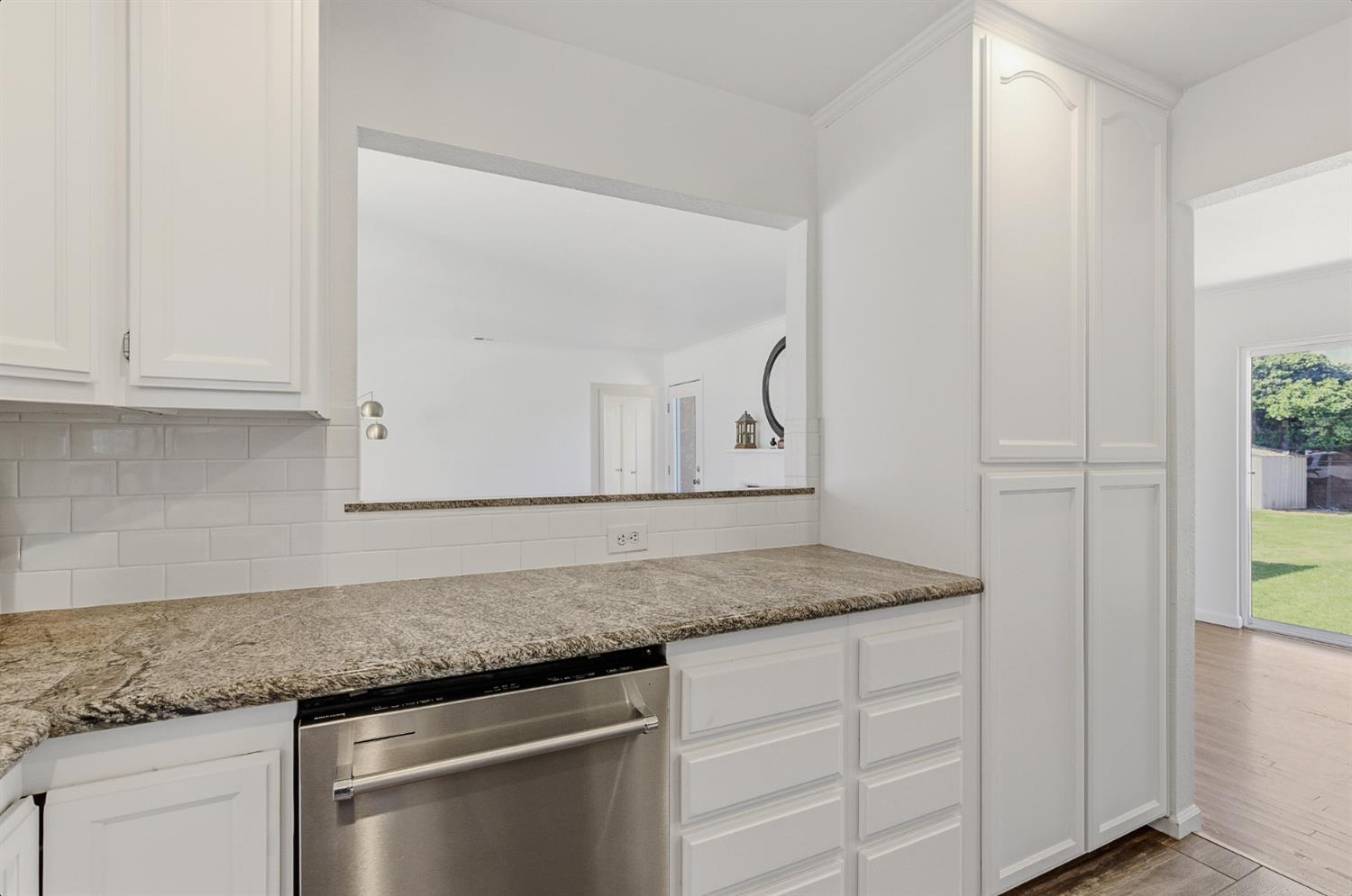 2511 Verna Way Sacramento, CA 95821 - Photo 20 of 34 a kitchen with granite countertop white cabinets and a granite counter tops