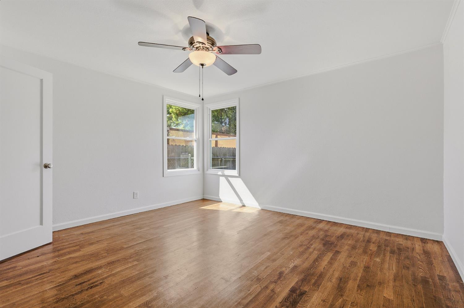 2511 Verna Way Sacramento, CA 95821 - Photo 22 of 34 a view of an empty room with wooden floor and a window