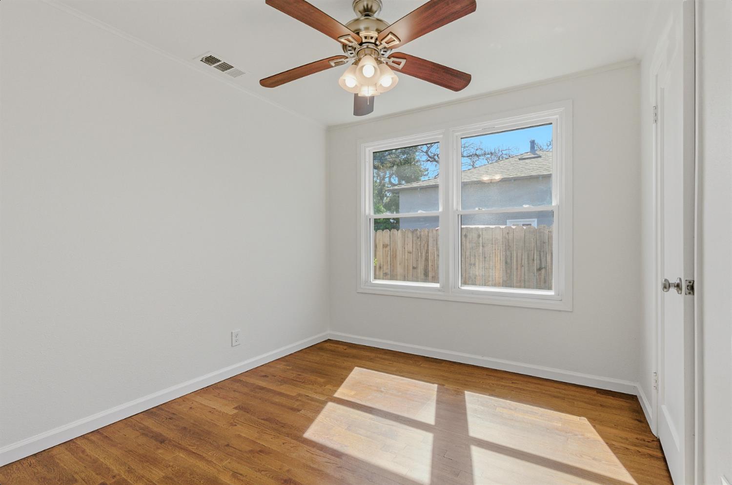 2511 Verna Way Sacramento, CA 95821 - Photo 24 of 34 wooden floor in an empty room with a window