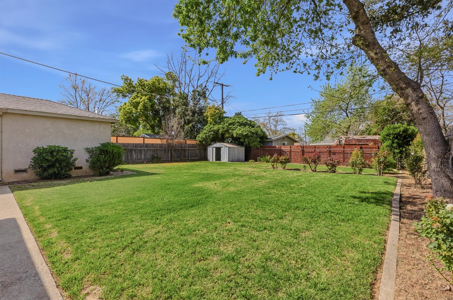 2511 Verna Way Sacramento, CA 95821 - Photo 30 of 34 a view of house with backyard space and garden