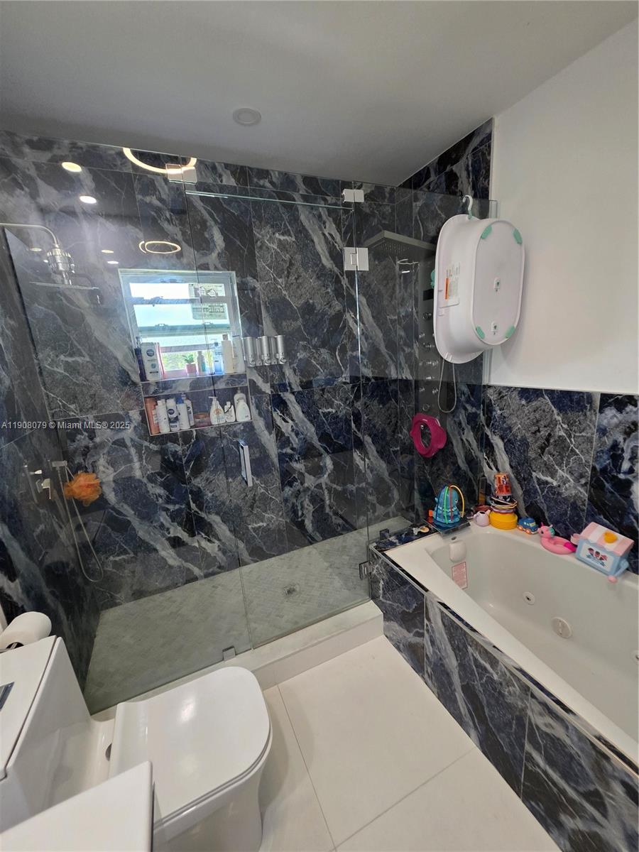 18200 Southwest 262nd Street Homestead, FL 33031 - Photo 15 of 30 a bathroom with a toilet sink and mirror