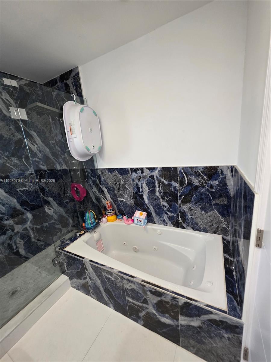 18200 Southwest 262nd Street Homestead, FL 33031 - Photo 16 of 30 a bathroom with a sink and a mirror